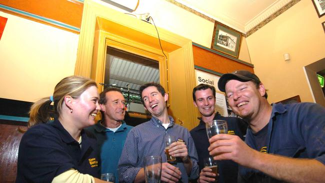 OLDEN DAYS: Liberal candidate for the marginal seat of Hindmarsh Simon Birmingham in 2004 (centre) and campaign manager Courtney Morcombe (left) having a beer with local Peter Francis at the Broadway Hotel, Glenelg 