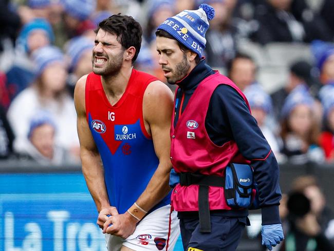 MELBOURNE, AUSTRALIA - JUNE 10: Christian Petracca of the Demons leaves the field injured during the 2024 AFL Round 13 match between the Collingwood Magpies and the Melbourne Demons at The Melbourne Cricket Ground on June 10, 2024 in Melbourne, Australia. (Photo by Dylan Burns/AFL Photos via Getty Images)