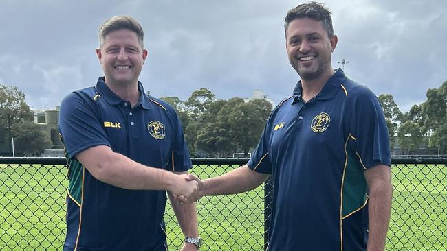 Michael Hill with Yarraville captain-coach Mitch Johnstone.