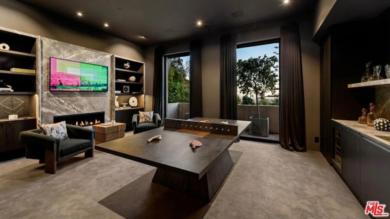 There are lots of spaces for entertaining, such as the game area. (Picture: Realtor.com)