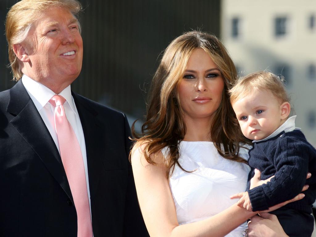 Barron Trump, 13, towers over his parents Donald and Melania Gold