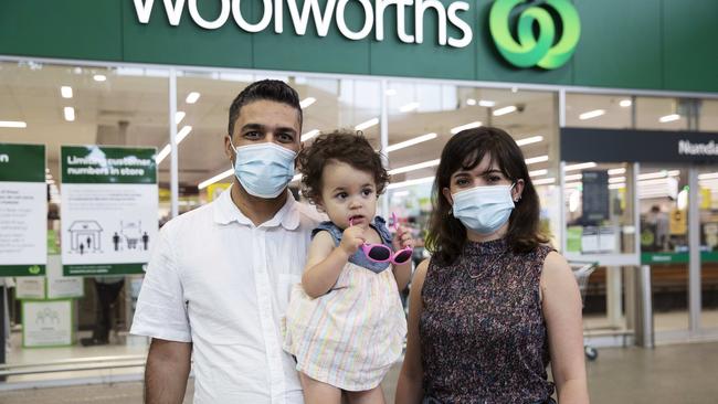 Ghasem Jahedi, Sarina Jahedi, 2 and Maryam Rahimi posing after shopping at Woolworths Nundah. Picture: Attila Csaszar