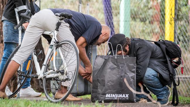 People appear to use drugs in front of Richmond West Primary School. Picture: Jake Nowakowski