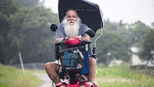 'Bulley' – Leigh Bulley – gets wet as he rides his mobility scooter – with shopping in the basket – in the rain at Stratford. Picture: Brian Cassey