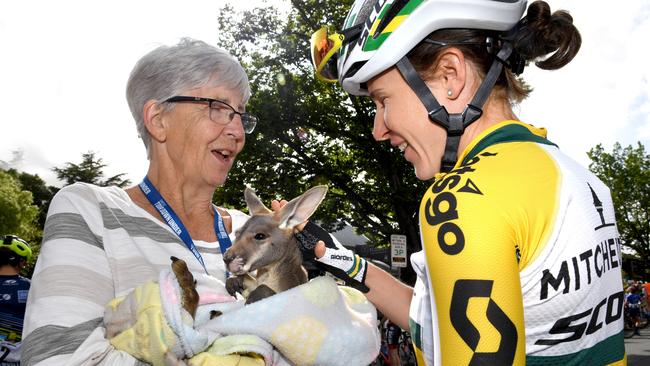 Ann Pashley from the Native Animal Network with joey Rudolf and Amanda Spratt before the start of the race at Hahndorf. Picture: Tricia Watkinson