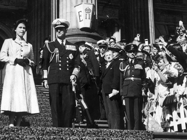 Queen Elizabeth and the Duke of Edinburgh on the steps of Parliament during their visit to Melbourne.