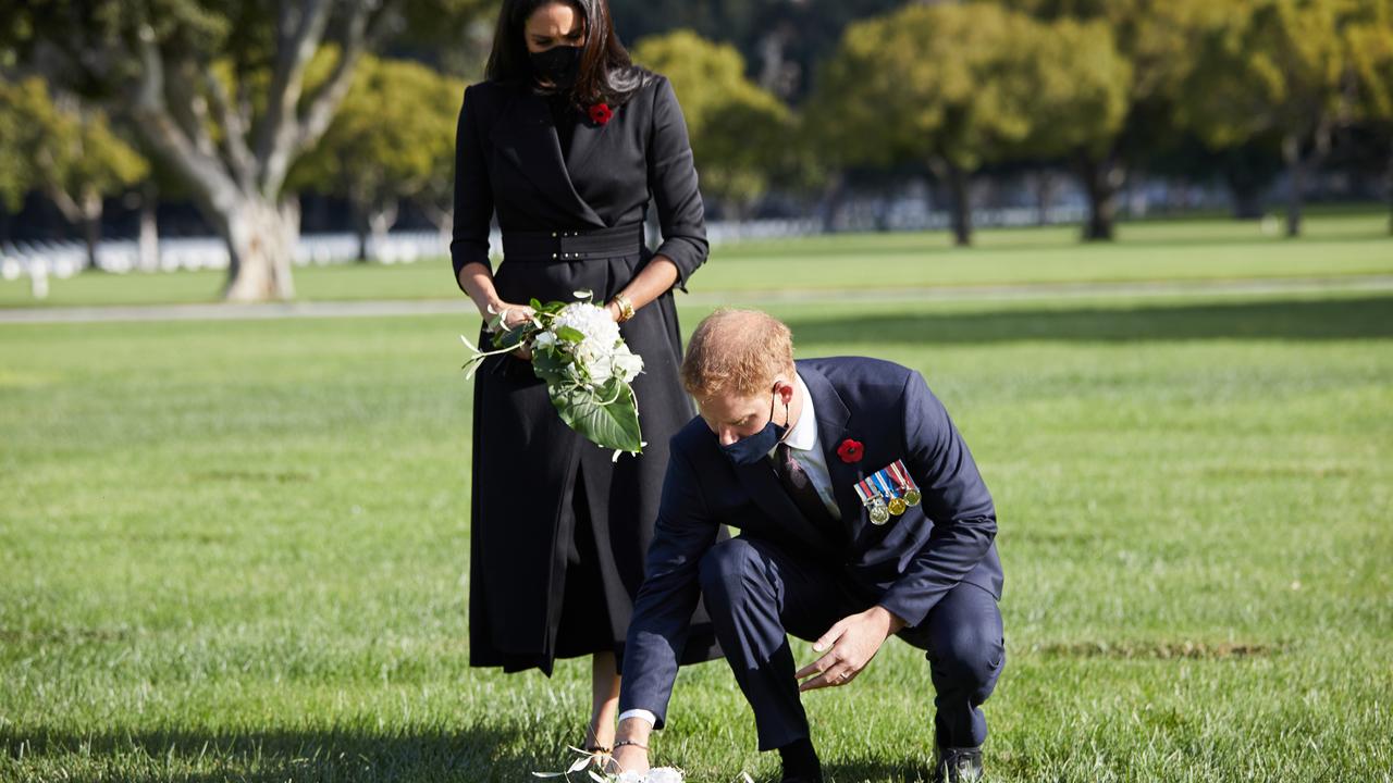 Prince Harry and Meghan Markle staged their own photo opp at Los Angeles National Cemetery on Remembrance Sunday last year. Picture: Lee Morgan/Handout via Getty Images