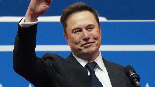 WASHINGTON, DC - JANUARY 20: Tesla, SpaceX and X CEO Elon Musk gestures while speaking during an inauguration event at Capital One Arena on January 20, 2025 in Washington, DC. Donald Trump takes office for his second term as the 47th president of the United States.   Christopher Furlong/Getty Images/AFP (Photo by Christopher Furlong / GETTY IMAGES NORTH AMERICA / Getty Images via AFP)