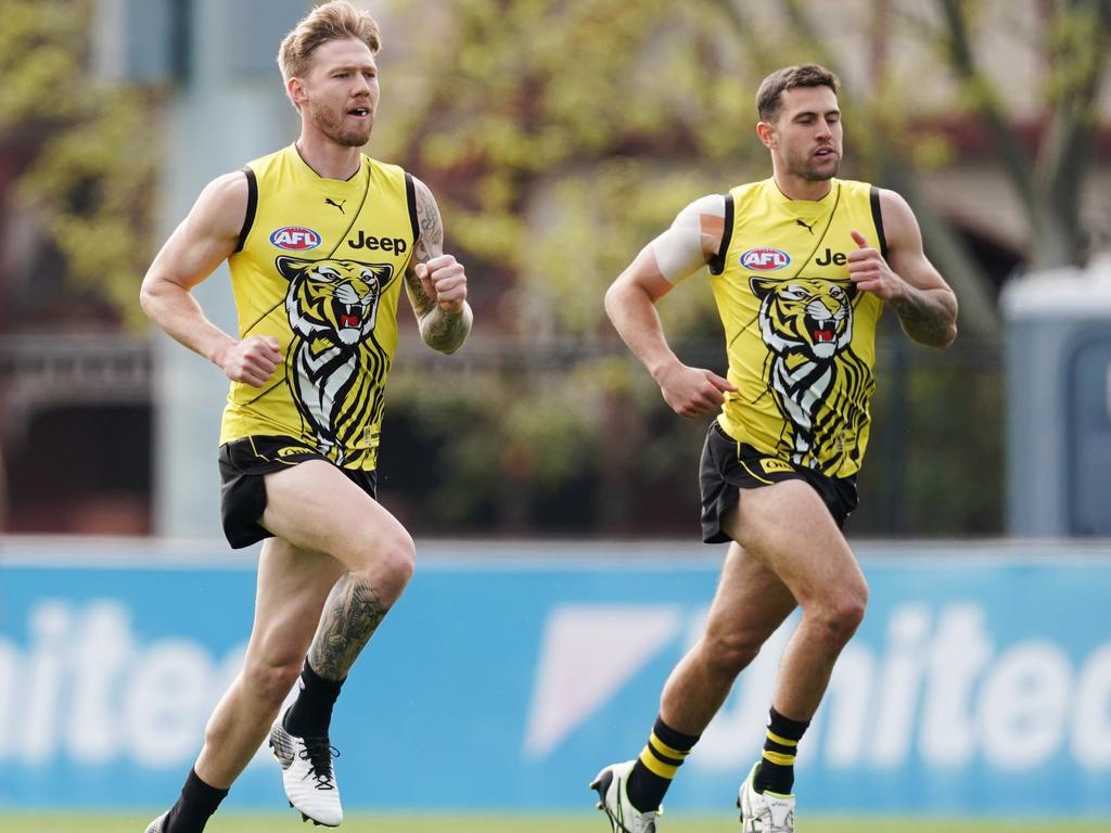 Nathan Broad and Jack Graham sprint during a Richmond Tigers training session.