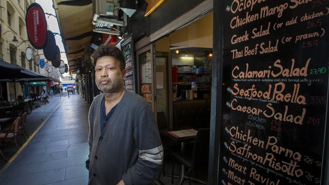 Cafe owner Johnny Sandish outside his cafe in Degraves Street business Picture: Wayne Taylor