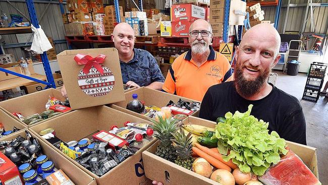 HOPE IN A BAG: Victory Church Maryborough Pastor Yuan Miller, volunteer Rowan McCrae and Pastor Tim Winnington with food hampers. Picture: Alistair Brightman