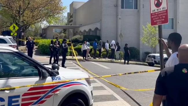 Police urged people in the area to look out for a green vehicle fleeing the scene after a gunman opened fire on mourners outside a funeral home. Picture: John Henry/WUSA9