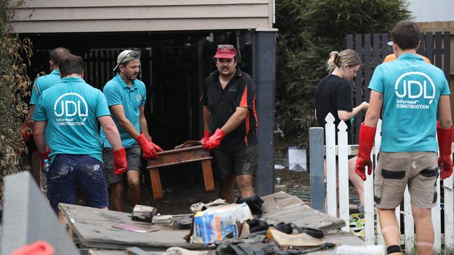 Cleaning up in Vincent St, Auchenflower. Picture: Annette Dew