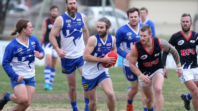 Sunbury Kangaroos Daniel Ellery sends his team forward. Picture: Hamish Blair