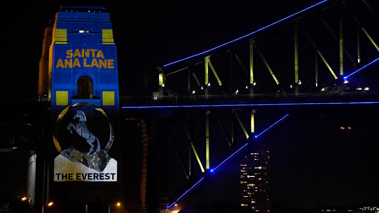 Santa Ana Lane's barrier draw is projected on a pylon of the Sydney Harbour Bridge.