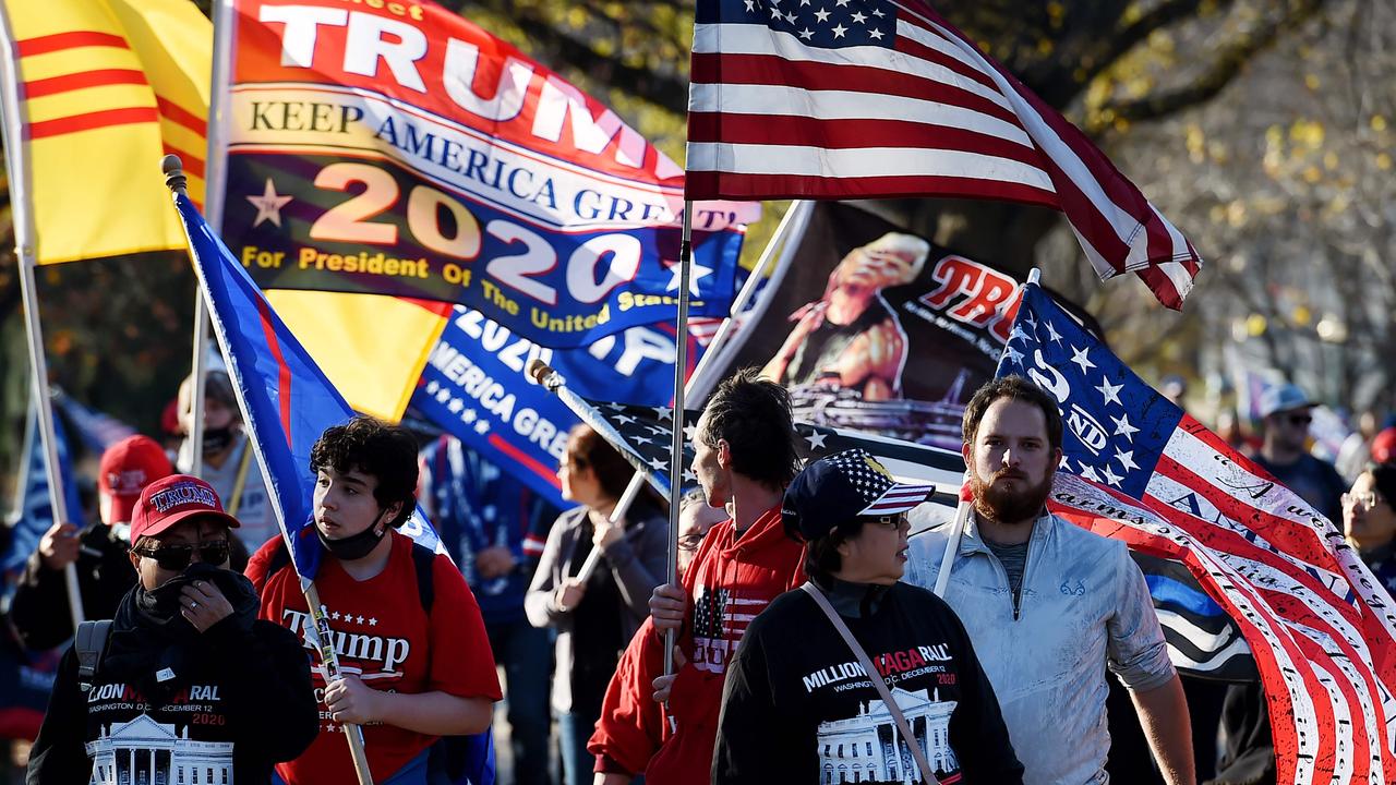 Supporters of US President Donald Trump participate in a MAGA march protest the outcome of the 2020 presidential election on December 12. Picture: Olivier DOULIERY / AFP.