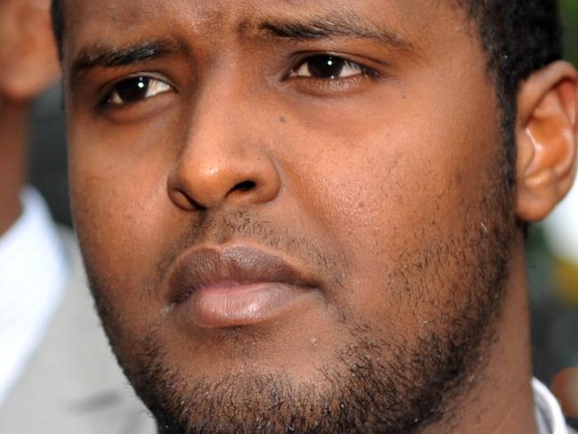 Yacqub Khayre (centre) and Abdirahman Amend leave court in Melbourne, Thursday, Dec. 23, 2010. The two men were acquitted by a Supreme Court jury, of planning an alleged terrorist attack on the Holsworthy army base in Sydney, while the other three co-accused were found guilty. (AAP Image/Julian Smith) NO ARCHIVING