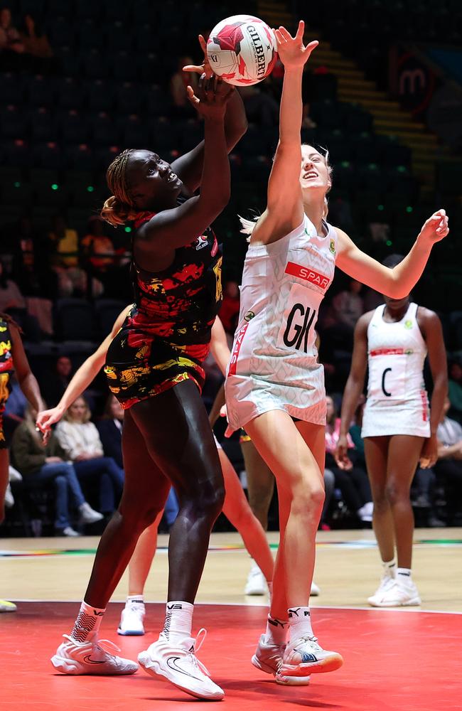 Sanmarie Visser defends against new Firebirds signing Mary Nuba Cholhok. Picture: Getty Images for England Netball