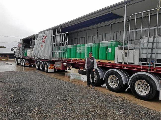 WATER DONATION: Brad Costigan donates water to the Granite Belt. Picture: Brad Costigan