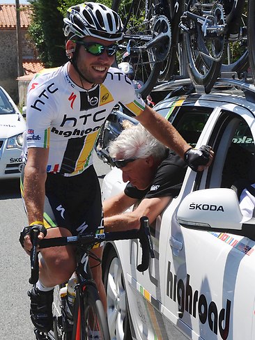 <p>HTC Highroad rider and winner of 15 Tour stages Mark Cavendish has his bicycle checked by a mechanic during the third stage of the 2011 Tour de France.</p>