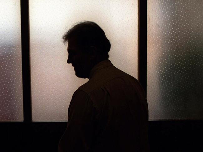 Generic image. Silhouette of a man (parent of) a sex abuse victim in an office. wrongly accused of touching young girl. Child sexual abuse. sex crime incest paedophilia.