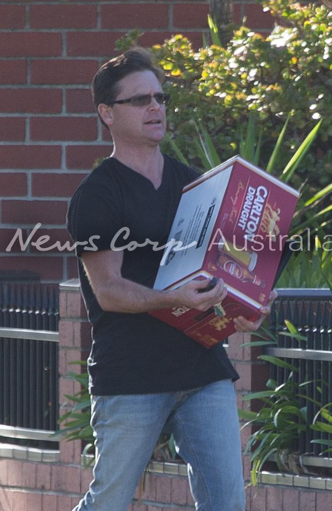 Danny Nikolic carries a slab into the Port Melbourne house as the family celebrates Yvette Nikolic’s release. Picture: Matrix for News Corp Australia