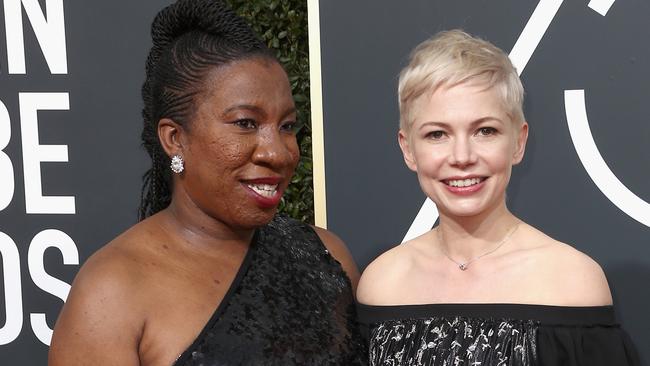 Activist Tarana Burke (left) who started the #MeToo movement and actor Michelle Williams attended this year’s Golden Globe Awards in black dresses to highlight the cause. Picture: Frederick M. Brown/Getty