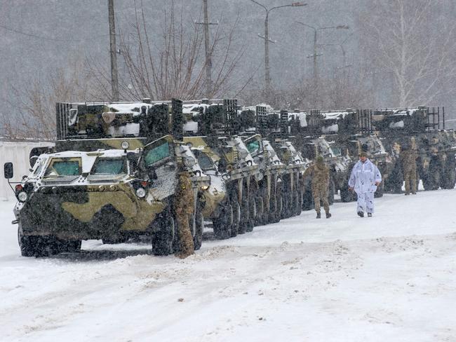 Ukrainian Armed Forces move to park in their base near Klugino-Bashkirivka village. The US says the Russian build-up troops at the border justifies crisis talks. Picture: AFP