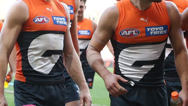 SYDNEY, AUSTRALIA - AUGUST 17: Giants players celebrate victory following the round 23 AFL match between Greater Western Sydney Giants and Fremantle Dockers at ENGIE Stadium on August 17, 2024 in Sydney, Australia. (Photo by Jason McCawley/AFL Photos/via Getty Images)