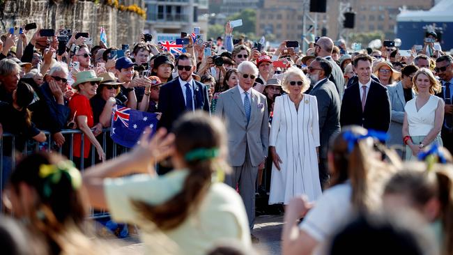 The couple watch a dance by school students. Picture: NewsWire / Nikki Short