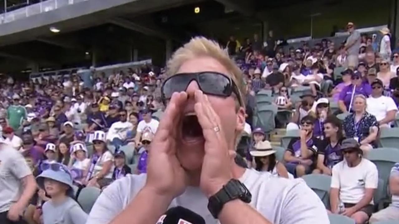 "Siren Man" demonstrates the wail during an interview at a Hobart Hurricanes game against the Brisbane Heat.