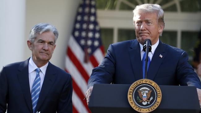 In the US, President Donald Trump certainly <i>is</i> leaning on Federal Reserve chairman Jerome Powell (left) to cut rates. Picture: AP