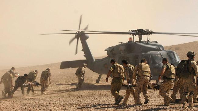 24/09/2008 NEWS: Caption: Australian and Afghan troops race to evacuate the civilian victims of a Taliban roadside bomb in Oruzgan Province, Afghanistan. Mid Caption: Soldiers from Reconstruction Task Force 4 have fought to save the lives of 4 Afghans, seriously injured by a Taliban roadside bomb during the holy month of Ramadan. 5 people died in the attack, after their car hit an Improvised Explosive Device when they stopped to change a tyre near Sorkh Morghab, 20 kilometres north of Tarin Kowt. The Diggers, who are building a medical centre in the area, worked with Dutch and Afghan troops to treat the 3 injured men and a young boy with head wounds, before they were flown by American helicopter to the Coalition hospital in Tarin Kowt.