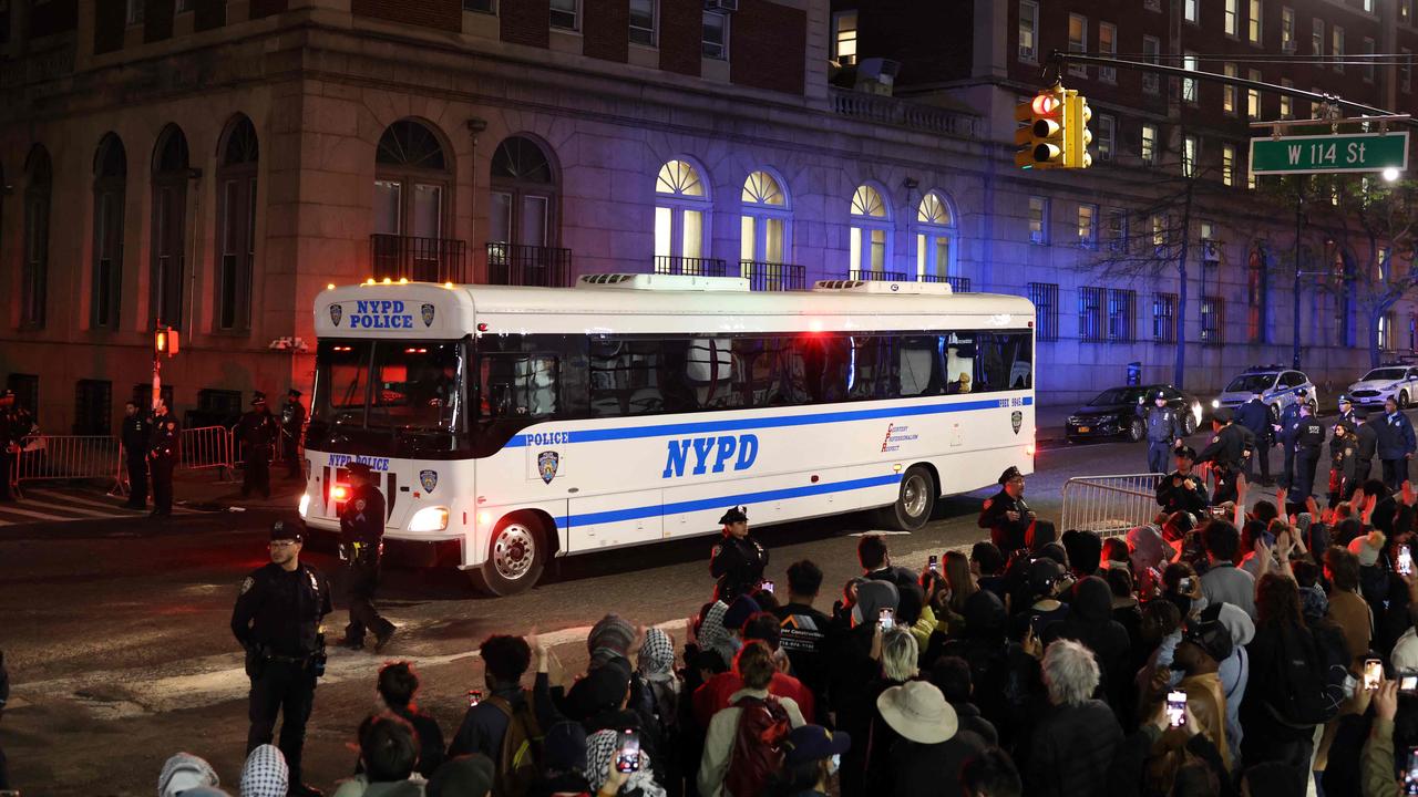 A NYPD bus carries arrested students. Picture: CHARLY TRIBALLEAU / AFP