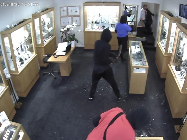 CCTV shows the moment the manager manages to get fellow staff to safety.