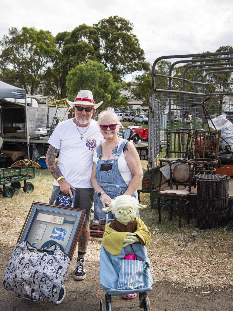 Cameron and Debbie Barnes of Hillcrest picked up framed Don Bradman memorabilia and a 1m tall Yoda at the Toowoomba Swap hosted by Darling Downs Veteran and Vintage Motor Club at Toowoomba Showgrounds, Saturday, February 1, 2025. Picture: Kevin Farmer