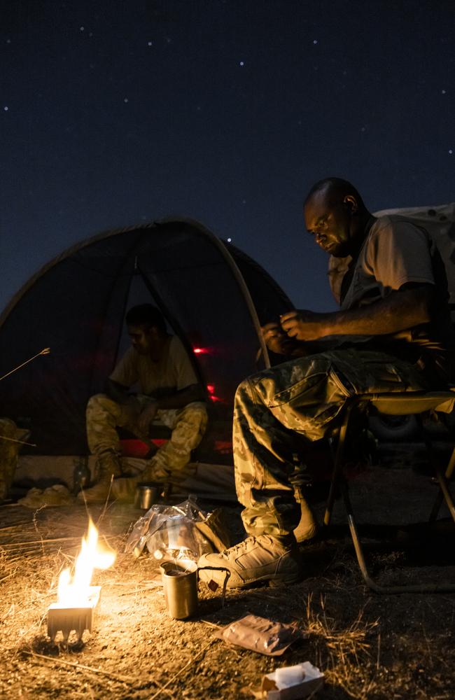 ADF tactical reconnaissance unit NORFORCE with Private Misman Kris preparing ration pack food during patrol about Wudikapildyerr, NT. Picture: Dylan Robinson