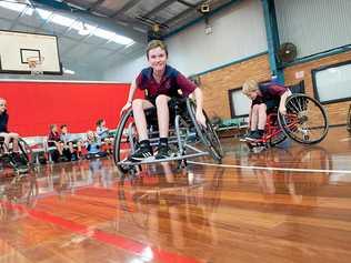 ALL IN: Aaron Saggus from Coffs Harbour Public School has a go at wheelchair sport at Sportz Central stadium. Picture: TREVOR VEALE