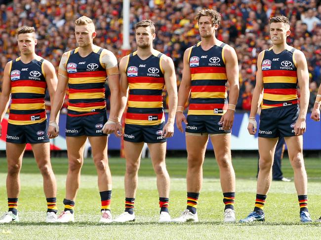 MELBOURNE, VICTORIA - SEPTEMBER 30:  Adelaide Crows players line up for the national anthem before the 2017 AFL Grand Final match between the Adelaide Crows and the Richmond Tigers at Melbourne Cricket Ground on September 30, 2017 in Melbourne, Australia.  (Photo by Darrian Traynor/AFL Media/Getty Images)