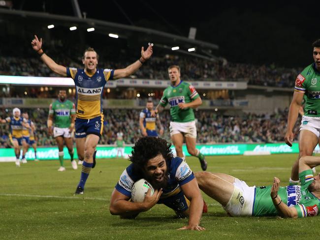 CANBERRA, AUSTRALIA - APRIL 17:  Isaiah Papali'i of the Eels celebrates with team mates after scoring a try during the round six NRL match between the Canberra Raiders and the Parramatta Eels at GIO Stadium on April 17, 2021, in Canberra, Australia. (Photo by Matt Blyth/Getty Images)