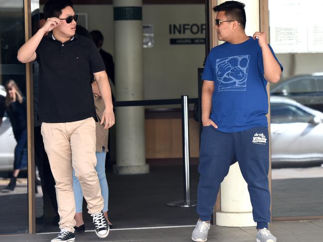 Supporters of Kevin Ly depart Fairfield Local Court after he was charged with two counts of murder in Sydney on Tuesday, Sept. 20, 2016. (AAP Image/Paul Miller)