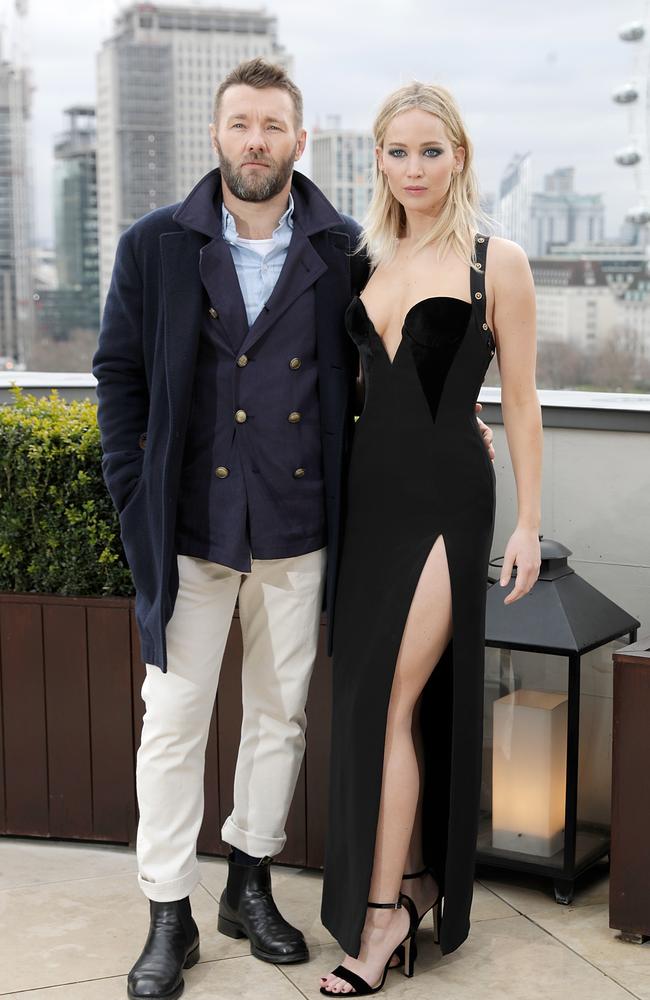 Edgerton and Lawrence. Come on man, lend her a jacket. Picture: Getty