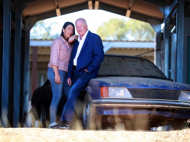 Ex detective and cold case specialist Damian Loone and Rachelle Childs sister Kristy stand with Rachelle's Commodore. Picture: Jeff Darmanin