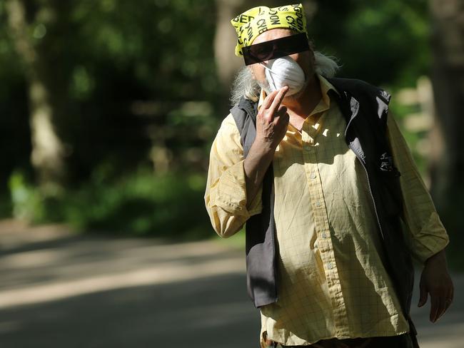 A man wearing PPE walks in the afternoon sunshine in north London, but as lockdown restrictions have eased, cases have risen in the UK. Picture: AFP