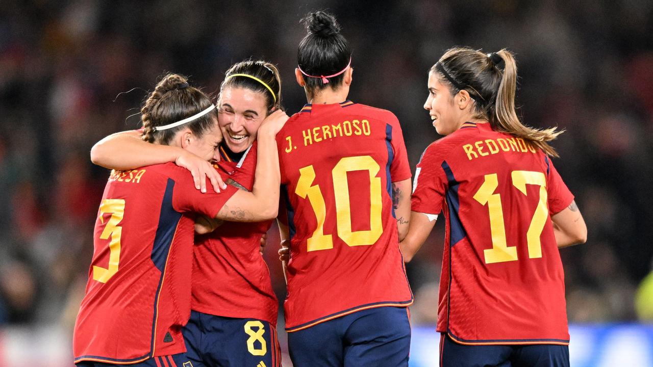 Spain's forward #08 Mariona Caldentey (2L) and Spain's midfielder #03 Teresa Abelleira (L) celebrate after Spain scored their first goal during the Australia and New Zealand 2023 Women's World Cup final football match between Spain and England at Stadium Australia in Sydney on August 20, 2023. (Photo by Izhar KHAN / AFP)