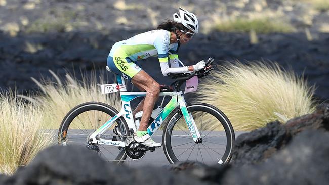 Turia Pitt rides through the lava fields during the bike leg . Pic: Michael Klein