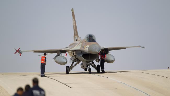 FILE - In this Nov. 25, 2013 file photo, Israeli air force technicians check an Israeli air force plane F-16 of the Red Dragon squadron at Ovda airbase near Eilat, southern Israel. Croatia's defense minister says Israel has failed to overcome U.S. objections to a plan to sell 12 used fighter jets to Croatia and the $500 million deal will likely be canceled. Damir Krsticevic spoke after a meeting with Israeli defense officials in Zagreb on Thursday, Jan. 10, 2019. (AP Photo/Ariel Schalit, file)