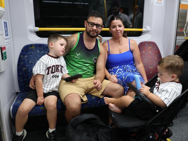 Traveller Adam Jones, partner Ffion Jones and their children George and Logan have changed plans and will drive to the NSW south coast this weekend instead of seeing the sights of Sydney. Picture: Rohan Kelly