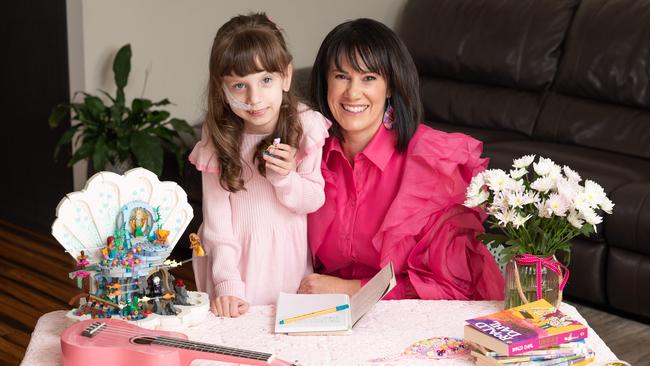 Leah Terry and her daughter Grace. Grace is in palliative care, although still going to school. Photo: Naomi Jellicoe