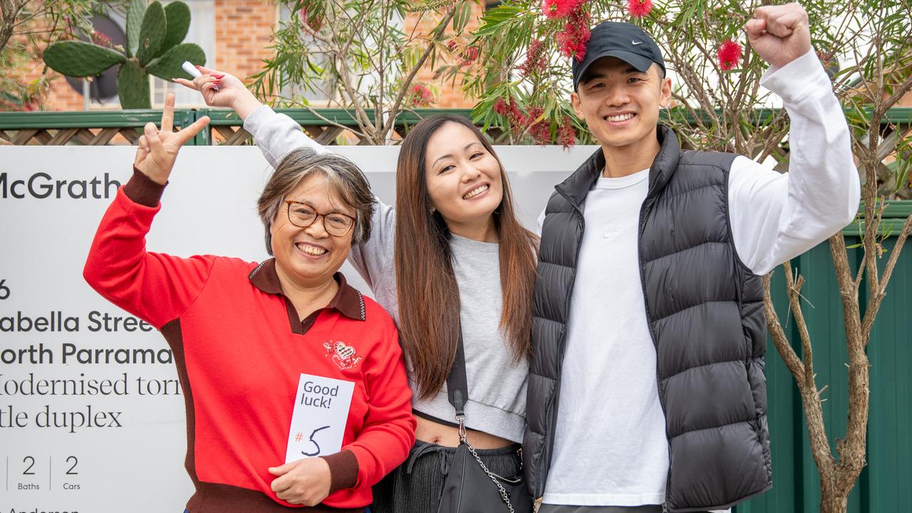 Anna Yang and partner Andy Lam with Anna’s mum Kathy Fu celebrate after winning 86 Isabella st, North Parramatta at auction. Picture Thomas Lisson